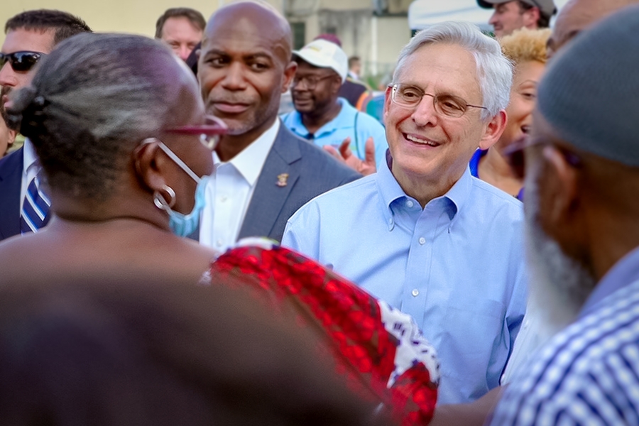 Attorney General Merrick B. Garland shakes hands with law enforcement and community members on National Night Out in Baltimore, MD.