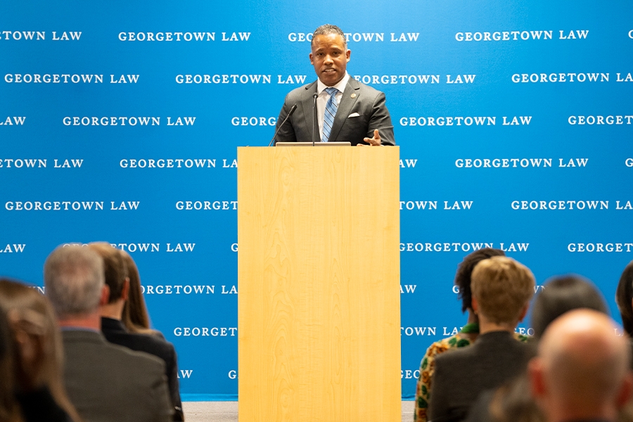 Assistant Attorney General Kenneth A. Polite Jr. speaks from a podium to students, staff, and attorneys at Georgetown Law.