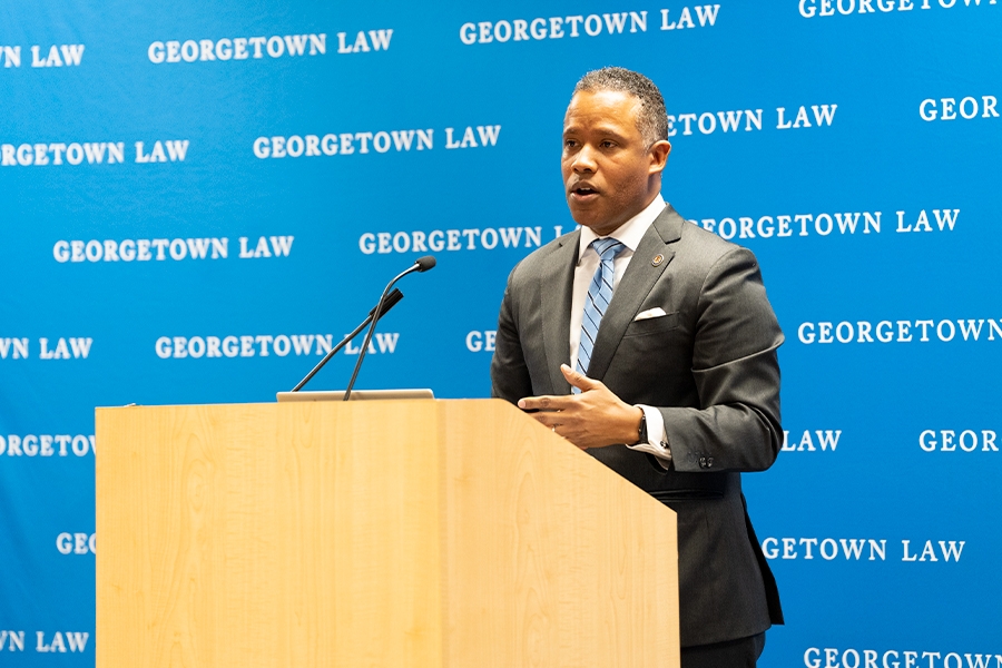 Assistant Attorney General Kenneth A. Polite Jr. speaks from a podium to students, staff, and attorneys at Georgetown Law.