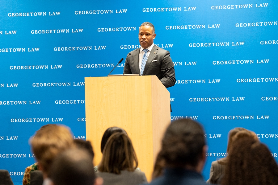 Assistant Attorney General Kenneth A. Polite Jr. speaks from a podium to students, staff, and attorneys at Georgetown Law.