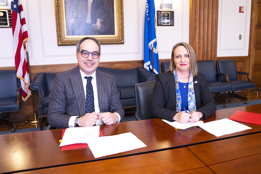 Assistant Attorney General Jonathan Kanter of the Justice Department’s Antitrust Division (left) and Inspector General Christi Grimm (right) sign a memorandum of understanding (MOU) to protect health care markets.