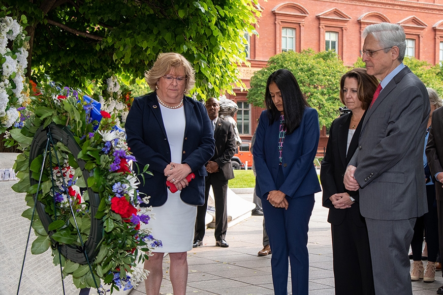 (From left to right) NLEOMF CEO Ferranto, Attorney General Garland, Associate Attorney General Gupta, and Deputy Attorney General Monaco review names at the National Law Enforcement Memorial.