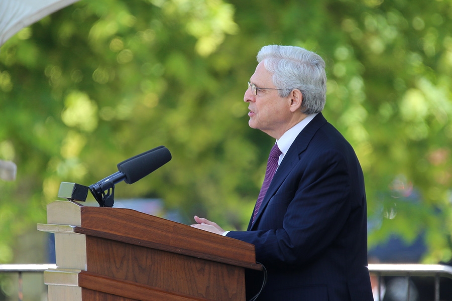 Attorney General Garland stands at a podium while addressing the crowd at the Annual National Peace Officer’s Memorial Service.