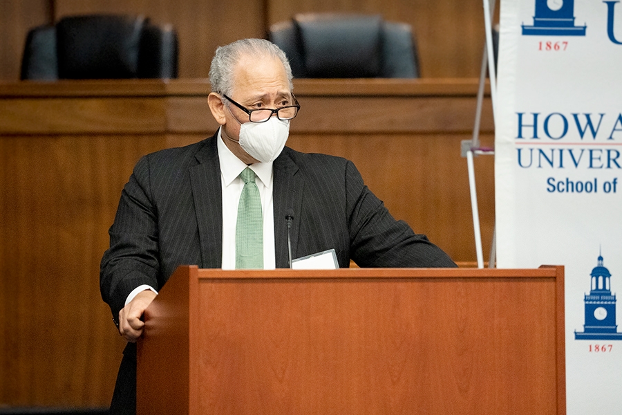 Howard School of Law Adjunct Professor Benjamin F. Wilson delivers remarks from a podium at Howard University School of Law.