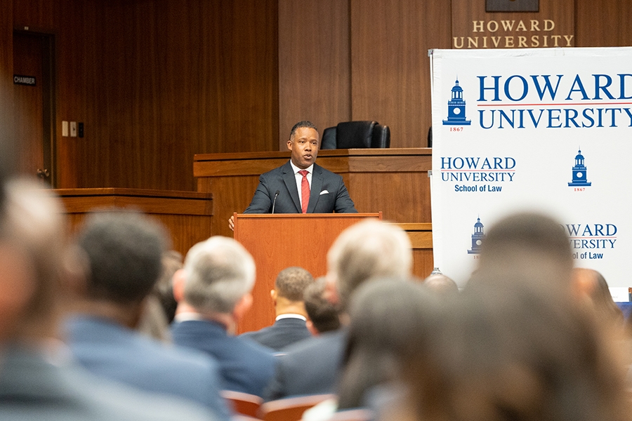 Assistant Attorney General Kenneth A. Polite, Jr. of the Criminal Division delivers remarks from a podium at Howard University School of Law.