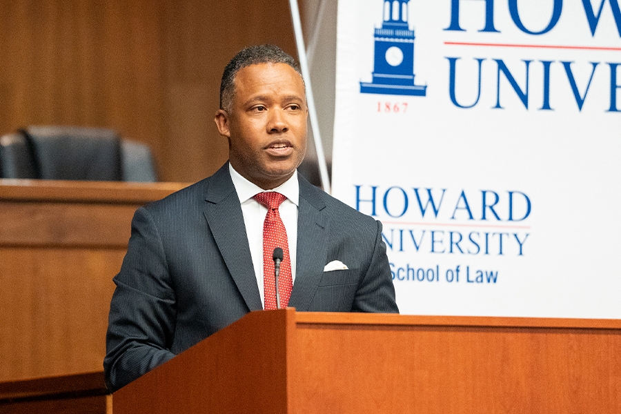 Assistant Attorney General Kenneth A. Polite, Jr. of the Criminal Division delivers remarks from a podium at Howard University School of Law.