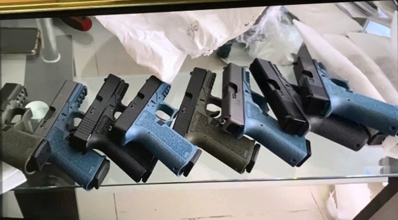 Photograph of firearms the defendant sent to buyers to advertise the firearms available for sale