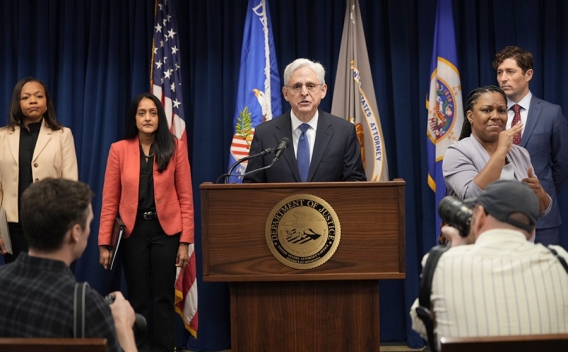 Attorney General Merrick B. Garland delivers remarks from a podium at the U.S. Attorney’s Office for the District of Minnesota.