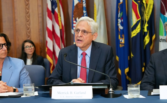 Attorney General Merrick B. Garland delivers at the Department of Justice. He is joined by Department of Justice and federal government officials.