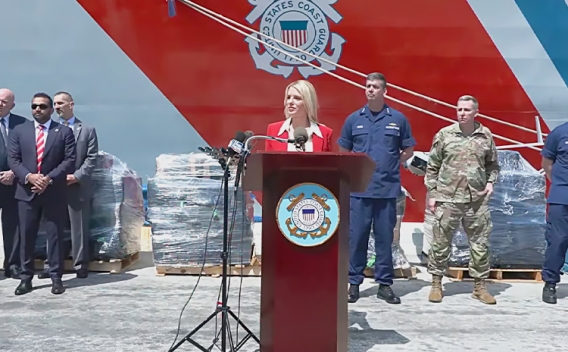 Attorney General Pamela Bondi delivers remarks from a podium at Port Everglades in Fort Lauderdale, Florida. She is joined by federal government officials.
