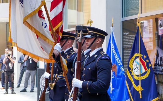 U.S. Honor Guards display and bear the Flag of the United States.