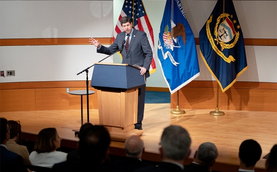 ATF Director Steven M. Dettelbach delivers remarks from a podium at the Bureau of Alcohol, Tobacco, Firearms and Explosives headquarters in Washington, D.C.