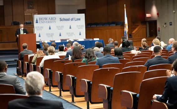 Attorneys and students sit in attendance at a Howard University lecture hall.