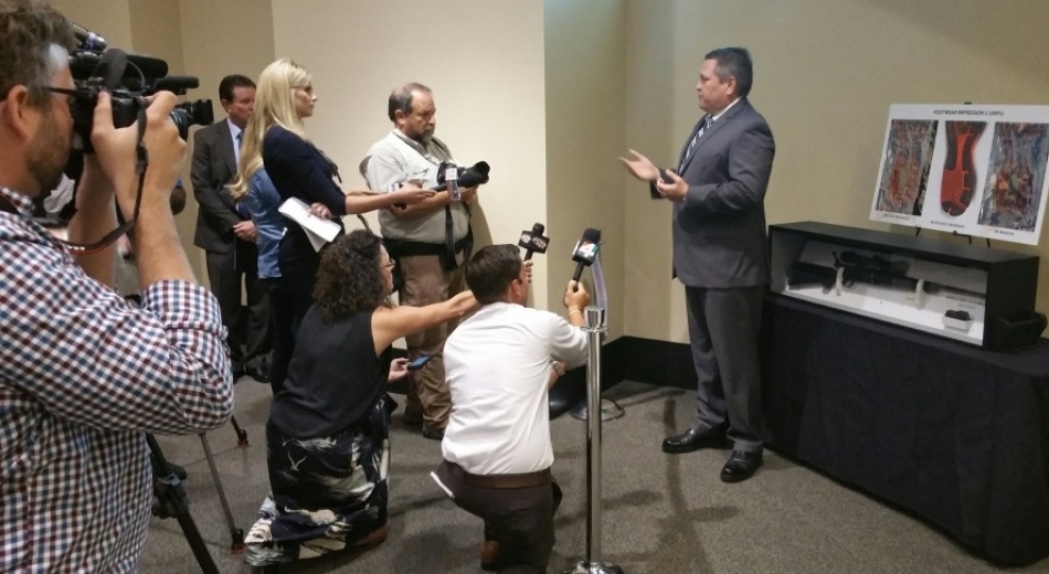 AUSA Heavener discussing case.