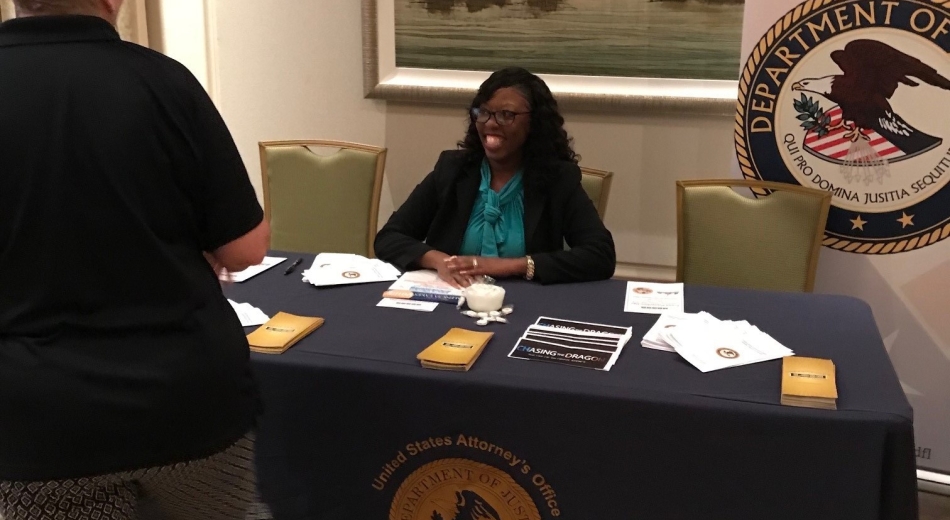 Outreach Specialist Khalilah Escalera speaks with attendees.