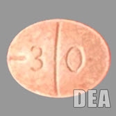 Counterfeit Adderall® pills, front and back