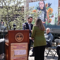 United States Attorney Zachary Cunha congratulates honoree Rebecca White, Program Coordinator for Youth Driven