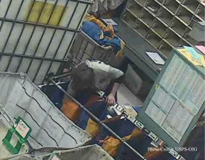  Picture captured from surveillance video of a former U.S. Postal Service Worker convicted of mail fraud.