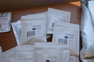 White resealable packets containing drugs on a table 