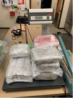 Bags of drugs piled up at the lab showing 35.2 pounds