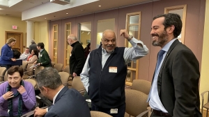 United States Attorney Zachary A. Cunha shares a light moment with an attendee of the latest United Against Hate workshop