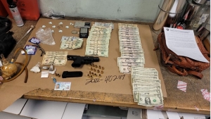 Drugs, gun, cash at arrest