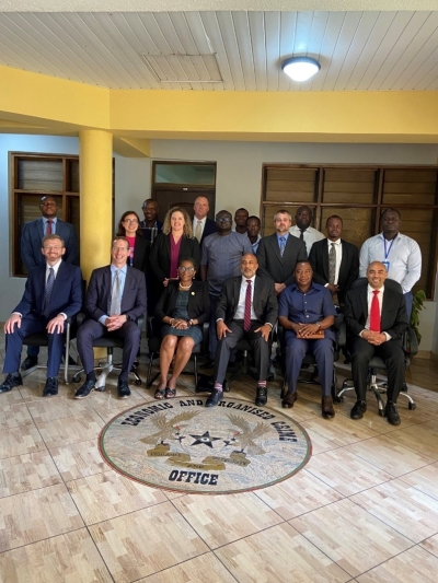 Deputy Assistant Attorney General Rao (front row, center, right), EOCO Deputy Director, Intelligence and Monitoring, Aba Opoku (front row, center, left), Assistant Legal Attaché Justin Nwadiashi (front row, right), and other officials from the Justice Department, FBI and EOCO meet at EOCO headquarters in Accra, Ghana.