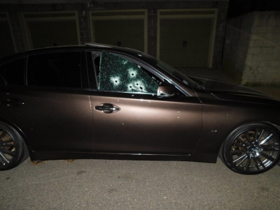 Image of car with gun shots to window
