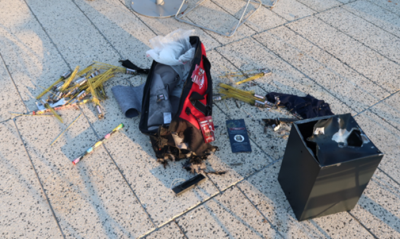 large tool bag, containing fireworks and electrical wires