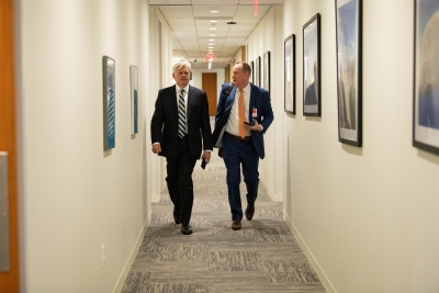 ENRD Environmental Crimes Section (ECS) Deputy Chief Joseph Poux (left) walks to the workshop. 