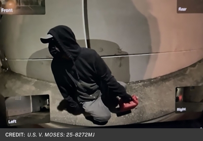 Image of suspect with gas can.