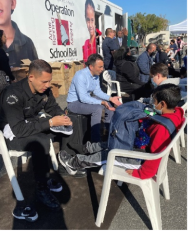 LAPD and U.S. Attorney's Office volunteering with the Operation School Bell with the Los Angeles Unified School District. 
