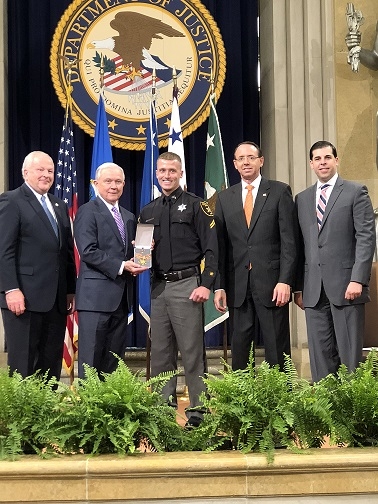 Corporal Richard White, III, of the Ohio County Sheriff's Office receives award from Attorney General Jeff Sessions. Corporal Richard White, III, of the Ohio County Sheriff's Office receives award from Attorney General Jeff Sessions.