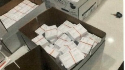 Social media post of fake COVID-19 vaccination record cards boxed up