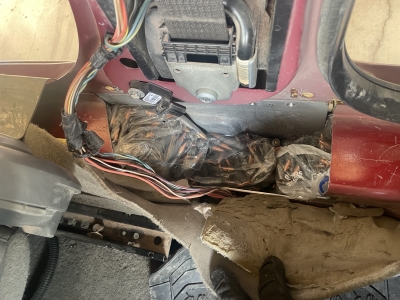 Photograph of bagged ammunition in compartment.