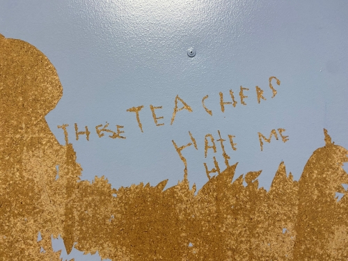 Student writing on the wall of a school seclusion room Student writing on the wall of a school seclusion room