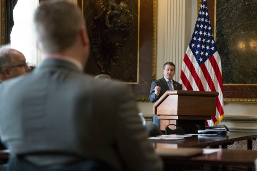 U.S. Attorney Trent Shores speaking at a podium.