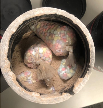 Rainbow pills concealed in container
