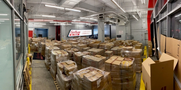 A photograph of boxes of counterfeit goods seized from the storage facility.