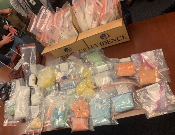 Photo of seized narcotics and other material recovered from the Apartment
