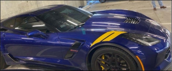 Blue Corvette in parking space