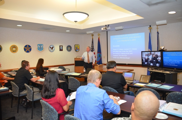 Picture of Assistant U.S. Attorney Thomas Colthurst giving an Overview of Financial Investigations and Money Laundering Laws 