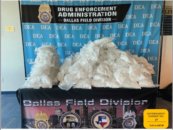 Government exhibit no. 27: Seized methamphetamine piled on a table at DEA's Dallas Field Division Government exhibit no. 27: Seized methamphetamine piled on a table at DEA's Dallas Field Division