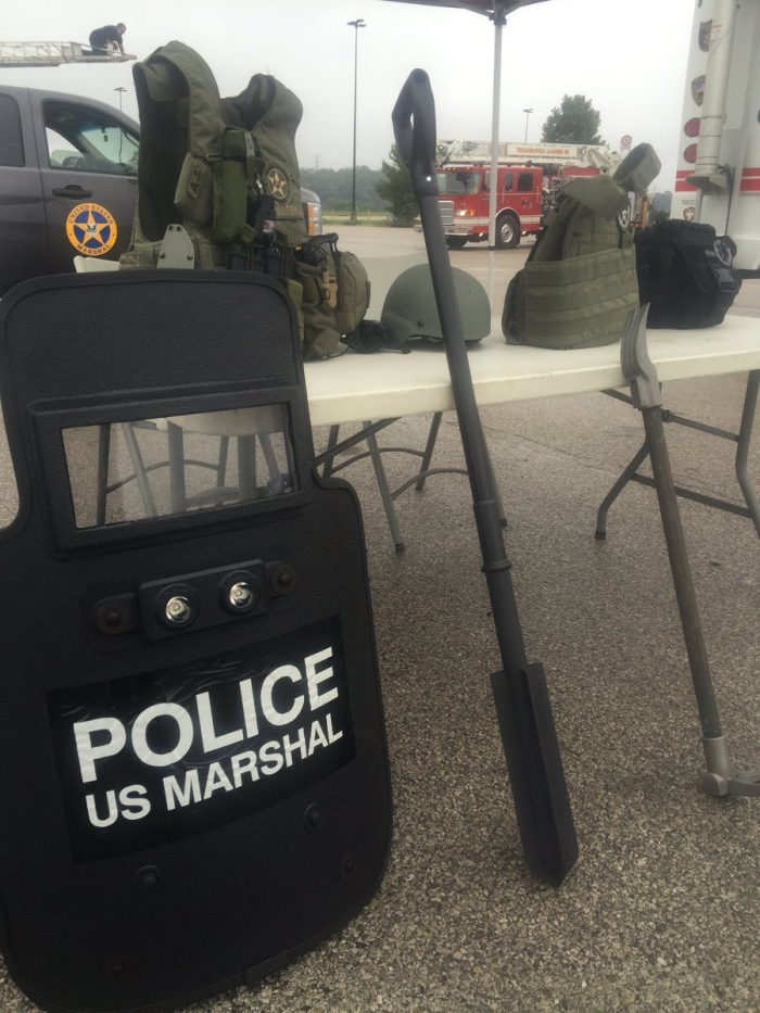The U.S. Marshals offer kids the chance to try on and test out their equipment safely.