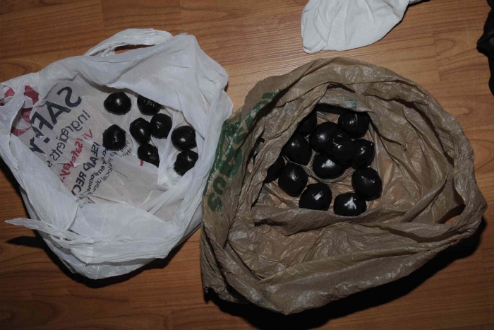 Exhibit 76b: Heroin balloons packaged for distribution