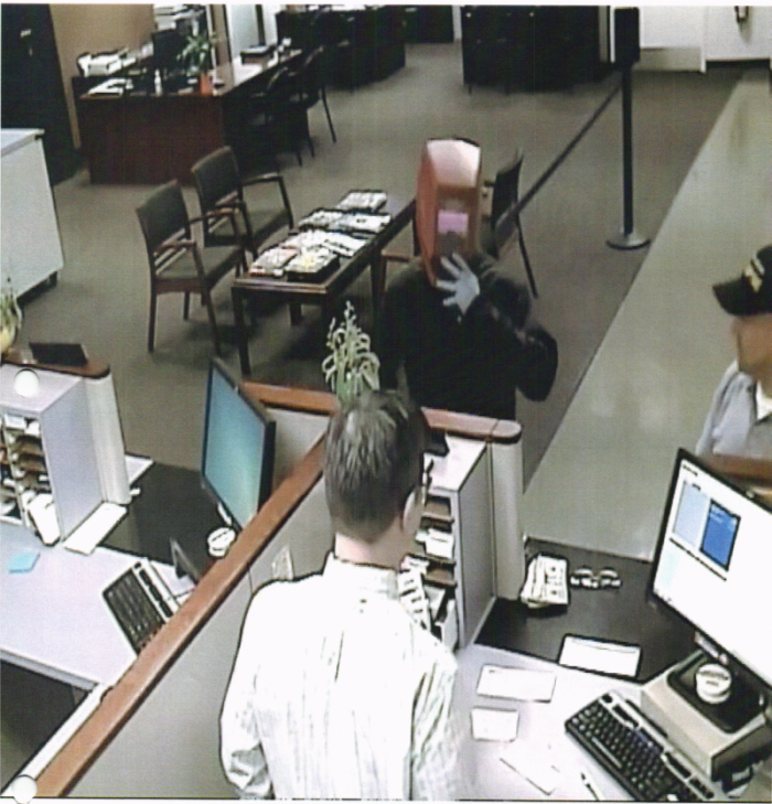 Photo of suspect wearing mask inside the bank