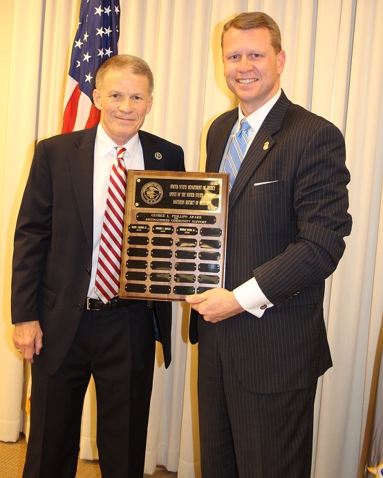 Mississippi Department of Public Safety Commisionser, Marshall Fisher, receives the George Phillips Award from U.S Attorney, Mike Hurst