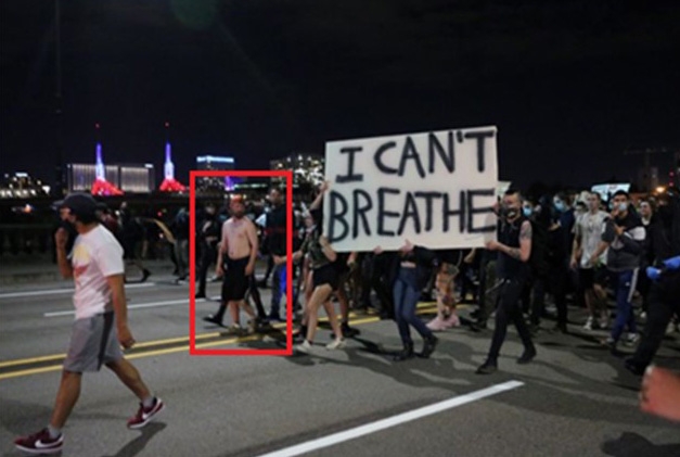 Schinzing marching with a crowd of demonstrators across the Burnside Bridge in Portland on May 29, 2020