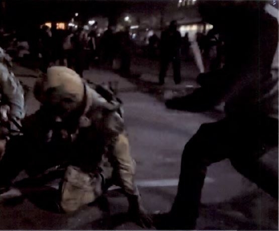 Second angle of Horton striking a deputy U.S. Marshal with a wooden baseball bat.