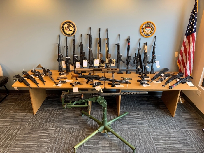 Photo of seized firearms on display